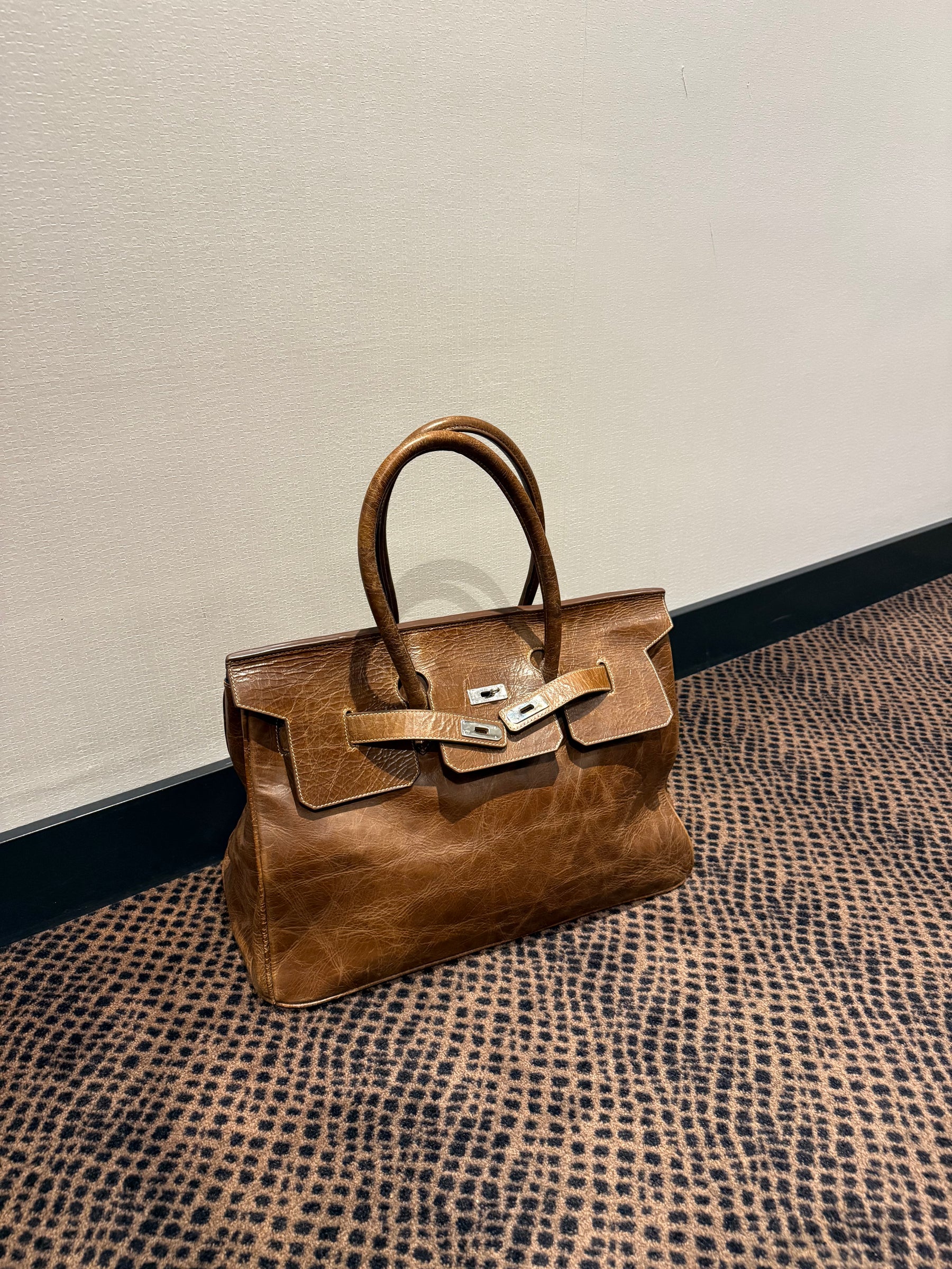 Vintage real leather firkin handbag washed brown with silver hardware.