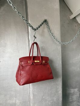 Vintage real leather handbag with gold hardware red