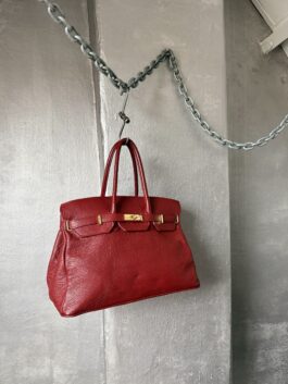 Vintage real leather handbag with gold hardware red